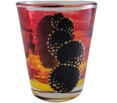 a glass with some black and white designs on it