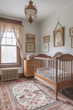 an old fashioned crib in the corner of a room with pictures on the wall