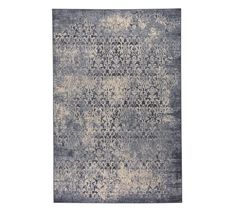 a rug with an abstract design on the front and back of it, in grey tones