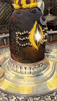 a cake decorated with yellow and black icing