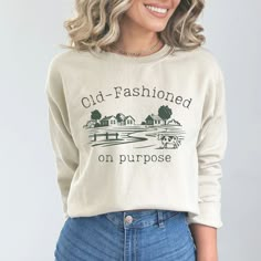 HOLIDAY ORDER DEADLINES HAVE PAST. Orders will still be accepted and will be processed as soon as possible, but may not arrive before Christmas Day.  Please plan accordingly as I am unable to provide refunds for orders that are delivered within their estimated window. This Homestead Sweatshirt is the perfect addition to any homesteader's wardrobe! Made with high-quality materials, it's perfect for chilly days spent working on the homestead or just relaxing by the fire.  -Loose fit -Runs true to size -50% cotton, 50% polyester -Sewn-in label  See the entire shop collection here: https://www.etsy.com/your/shops/EmyAndOlive Most designs in my shop are available to put on tshirts, sweatshirts, hoodies, tote bags, mugs, and more. Feel free to send me a message if you would like a custom order. Homestead Shirt Ideas, Buy My Stuff Graphic, Homemaker Shirt, Homemaker Outfit, Homestead Outfits, Homestead Shirt, Home Stead, Homeschool Shirts, Farmer Shirt