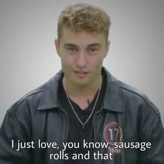 a young man in a black jacket is looking at the camera and has an interesting quote on it