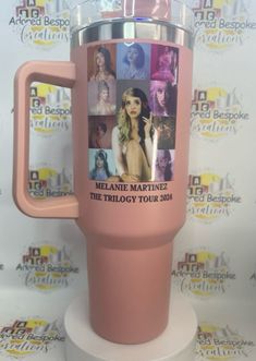 a pink travel mug with pictures of women on it and the words melanie marquinze