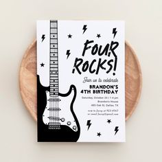 a black and white birthday card with an electric guitar on the front that says four rocks