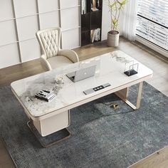 a white desk with a laptop on it in front of a window and a chair