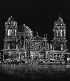 a black and white photo of an old building with two large domes on it's roof