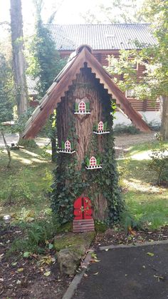 a house made out of a tree trunk