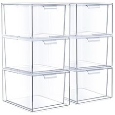 four clear storage bins stacked on top of each other