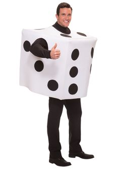 a man in a costume that is holding a giant white and black polka dot dice