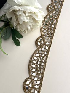 This Indian mirror embellished border beautifully crafted Indian mirror belt is very pretty for kaftans, mirror belts, embellished necks, saree trims, lehngas, sari borders, dupatta trims. Let your creativity flow and enhance your outfit :    Experience the magic of our geometric mirror  Trim, a true game-changer when it comes to adding a touch of glamour to your outfits. Picture shining mirror work in dazzling gold, masterfully crafted in a cutwork design, elevating your style to the next level Indian Mirror Work, Mirror Work Border, Mirror Belt, Indian Mirror, Sarees Blouse, Suit Neck, Mirror Work Blouse Design, Geometric Mirror, Mirror Work Blouse