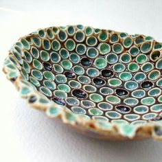 a decorative bowl is sitting on a table