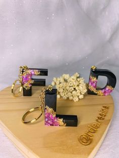 the letters e, f, and d are made out of wood with flowers in them