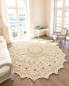 a large white doily rug in a bedroom