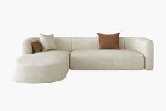 a large white couch with pillows on it's back and side ends, sitting in front of a white background