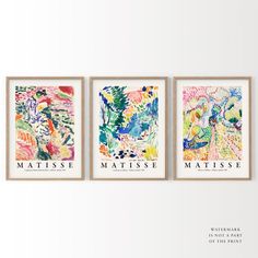 three framed art prints with different colors and designs on the wall above them are words that read matissee, matissee, matissee, matissee