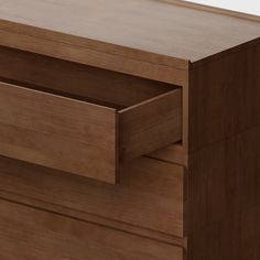 a close up of a wooden dresser drawer