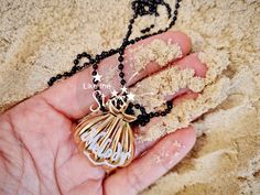 Introducing our shiny Gold Melody Shell Locket, inspired by "The Little Mermaid." This enchanting seashell pendant necklace is perfect for cosplay or as a mermaid lover's gift. With intricate detailing and a gold finish, it opens to hold cherished mementos. Embrace your inner mermaid and order yours today! The ball chain available in 2 colors of your choice - gold and black. You will love it this i can guarantee ! The Little Mermaid Melody, Shell Locket, Fantasy Crown, Mermaid Magic, Seashell Pendants, Mermaid Lover, Mermaid Necklace, Jewellery Sets, Silver Jewellery Sets