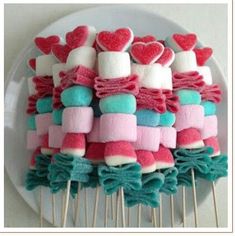 marshmallows are arranged on top of other marshmallows in the shape of hearts