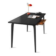 a black table with drawers underneath it and a red lamp on the top, in front of a white background