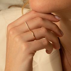 Meet the perfect dainty diamond band ring - the Pavé Diamond Ring. Studded in tiny diamonds, its classic design and dainty size make it the perfect everyday ring. It’s lightweight and solid gold, so it’s sure to give you a confidence boost and a little sparkle as you take on your day. Make it yours and treasure this classic forever! DETAILS 14k solid gold ring 24 lab-grown diamonds Diamond carat: 0.01 ct Diamond color & clarity: DEF-SI Available in sizes 5-8 Weight: 0.63g Safe for sensitive skin Single Rings Simple, Dainty Silver Jewelry Rings, Gold Ring Dainty, Rings On Short Fingers, Gold Rings Dainty, Simple Gold Rings Everyday, Everyday Ring Stack, Rings Gold Simple, Minimal Rings Minimalist Jewelry