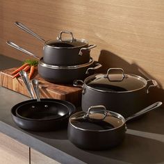 an assortment of pots and pans on a counter