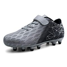 a pair of soccer shoes with spikes on the soles and one shoe has an intricate pattern