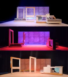 the stage is set up for an upcoming play with furniture and lighting on it, as well as a couch