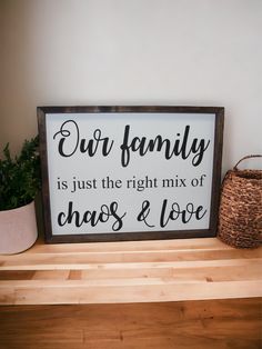 a sign that says our family is just the right mix of chaos and love