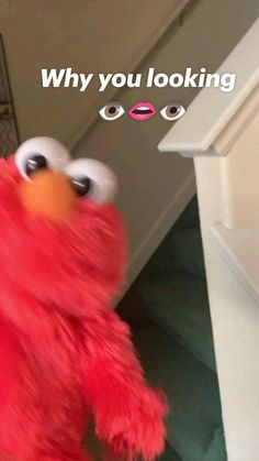 the sesame street character is standing in front of a door with his eyes wide open