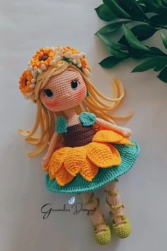 a crocheted doll sitting on top of a table