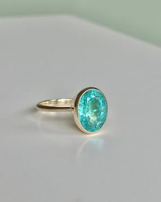 Hand sculpted bezel setting ring with natural earth mined genuine brazilian neon blue lagoon color paraiba apatite. Bezel Setting Ring, Paraiba Tourmaline Ring, Apatite Ring, Bezel Set Ring, Paraiba Tourmaline, Tourmaline Ring, Put A Ring On It, Blue Lagoon, Neon Blue