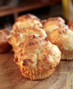 some muffins are sitting on a cutting board