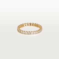 a yellow gold ring with small diamonds