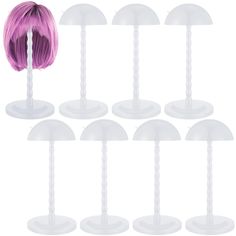 a bunch of white plastic stand with pink hair