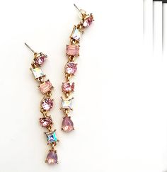 Multi Color Pastel Beaded Dangle Earrings What really makes these stand out is the gorgeous mix of multiple pink shades and clear aurora borealis stones that give them an elegant glam and sophisticated look.   These are also a perfect gift for friends, family or for yourself .... and why not you deserve it !  These are very lightweight and easy to wear. Length:      3 " long including the post  Materials:  Crystal stones in variations of pink mixed in  with clear aurora borealis on a 14K gold plated brass setting  Post:          Multi faceted crystal stone and stainless steel post  are allergy free FREE SHIPPING on all items in the US  💚 All items are shipped in gift boxes to insure safe delivery Pastel Beads, Earrings Chandelier, Pink Shades, Steel Post, Color Pastel, Crystal Stones, Beaded Dangle Earrings, You Deserve It, Allergy Free