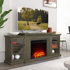 an entertainment center with a fireplace in the middle