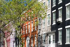 a row of multi - colored buildings in the city