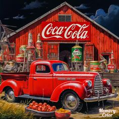 an old coca cola truck parked in front of a red barn with apples and tomatoes