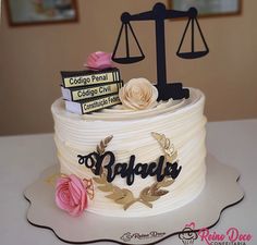 a cake that is sitting on top of a table with a judge's scale