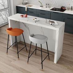 two stools sit at an island in the middle of a kitchen with marble countertops