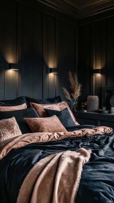 a bedroom with black walls and brown bedding