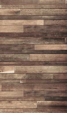 wood planks are arranged in a pattern on the wall, and one is brown