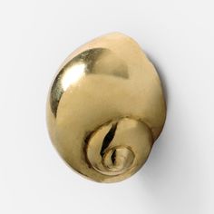 a gold door knob on a white wall