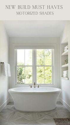 a white bath tub sitting next to a window