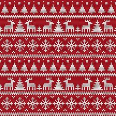 a red knitted christmas sweater with white snowflakes and trees on the bottom