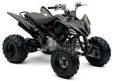 a black four - wheeler is shown on a white background