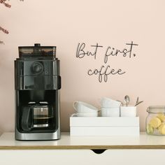 a coffee maker sitting on top of a counter