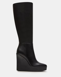 The AKIRA knee-high boot features a platform wedge design and a convenient inside zipper for easy on and off. Elevate your style game with this versatile and stylish boot, perfect for any occasion. 4.5 inch heel height Size 6 measurements: 14 inch shaft circumference, 13.75 inch shaft height Size 8 measurements: 15 inch shaft circumference, 14.75 inch shaft height Size 10 measurements: 16 inch shaft circumference, 15.75 inch shaft height Leather upper material Textile lining Synthetic sock Synth Black Wedge Boots, Knee High Platform Boots, Platform Boots Women, Summer Wardrobe Staples, Steve Madden Boots, Black Wedge, Stylish Boots, 5 Inch Heels, Platform Wedge