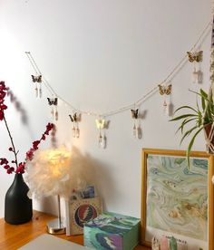 a desk with some flowers and pictures on it