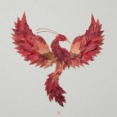 a bird made out of leaves on a white background